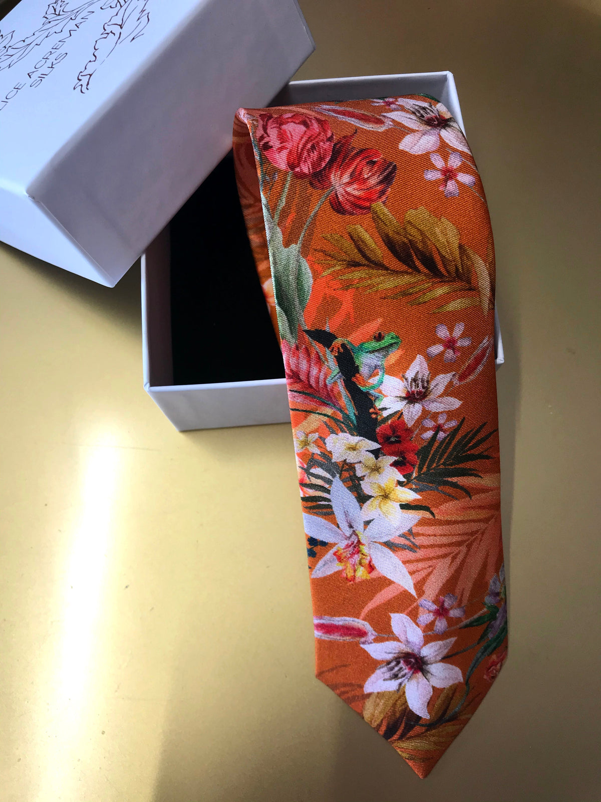 Rust orange coloured Silk Tie, 'Eden' tropical meadow print – view 6