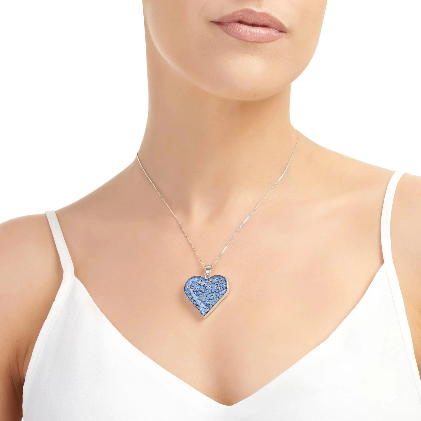 Forget-me-not heart necklace by  Shrieking Violet® Sterling silver heart filled with real forget-me-not flowers. Mothers day jewellery gift